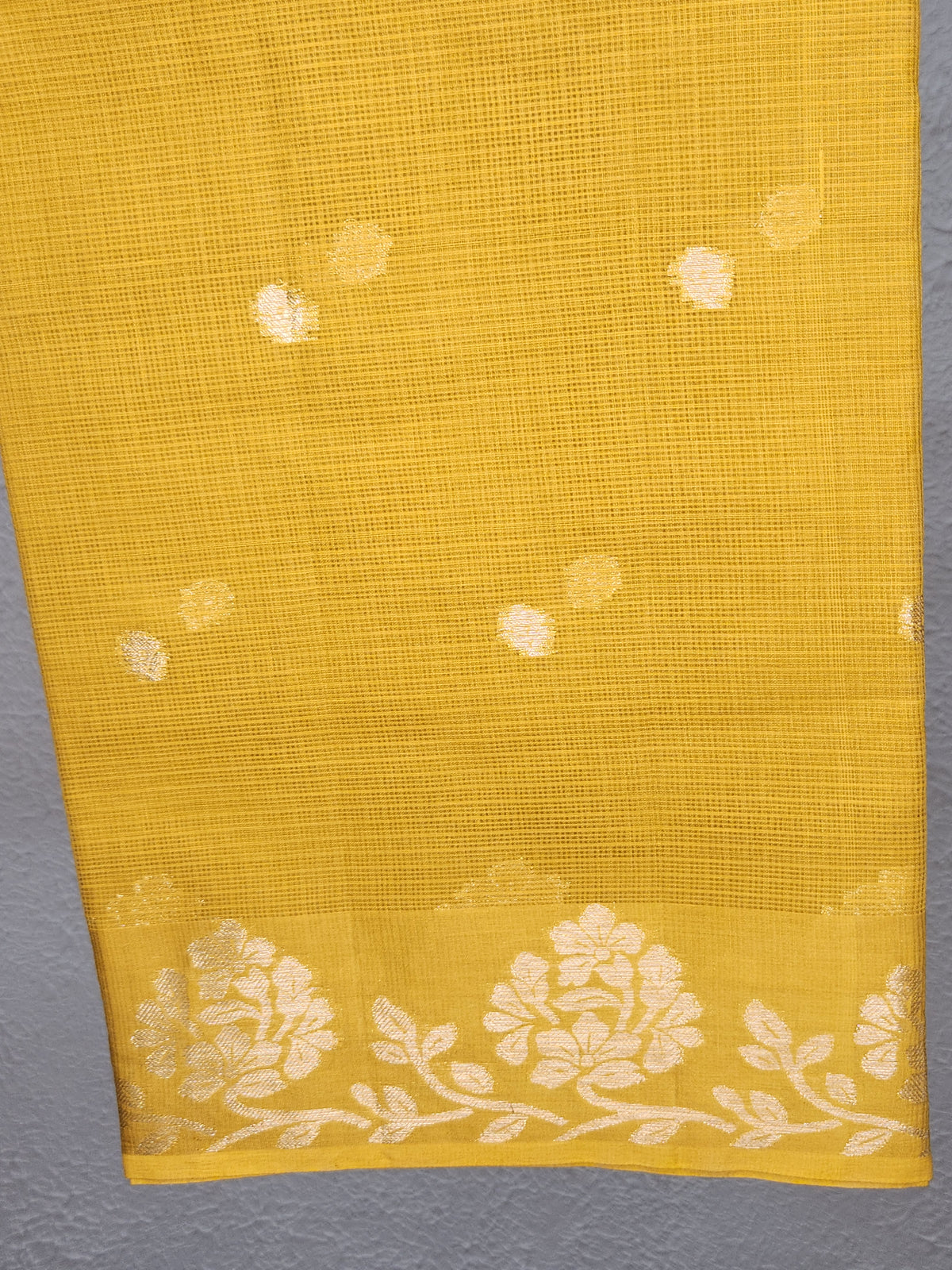 yellow saree with gold zari dots